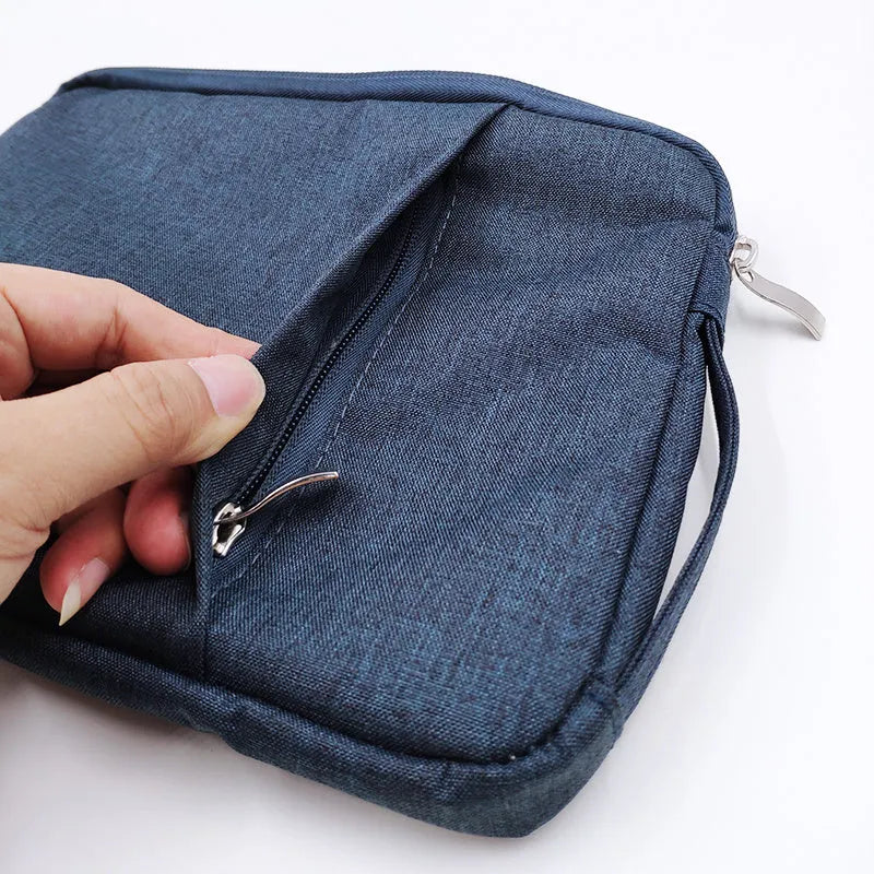 Grey canvas laptop sleeve case for a 12.9-inch iPad Pro, showing the YKK zipper and minimalist notebook design.