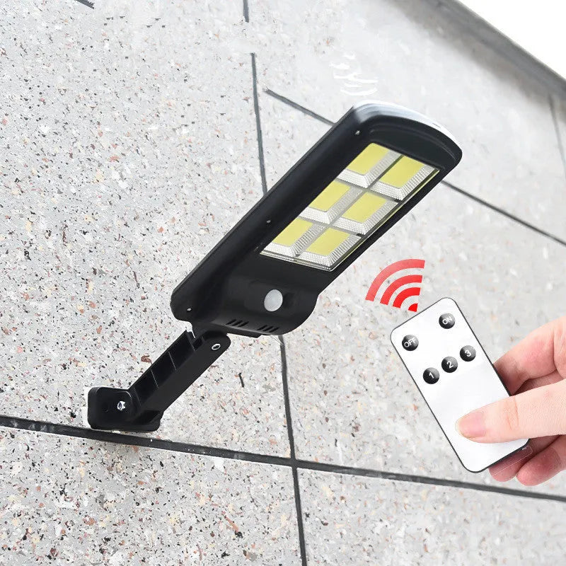 Black outdoor solar motion sensor light with solar panel and IP65 weatherproof rating