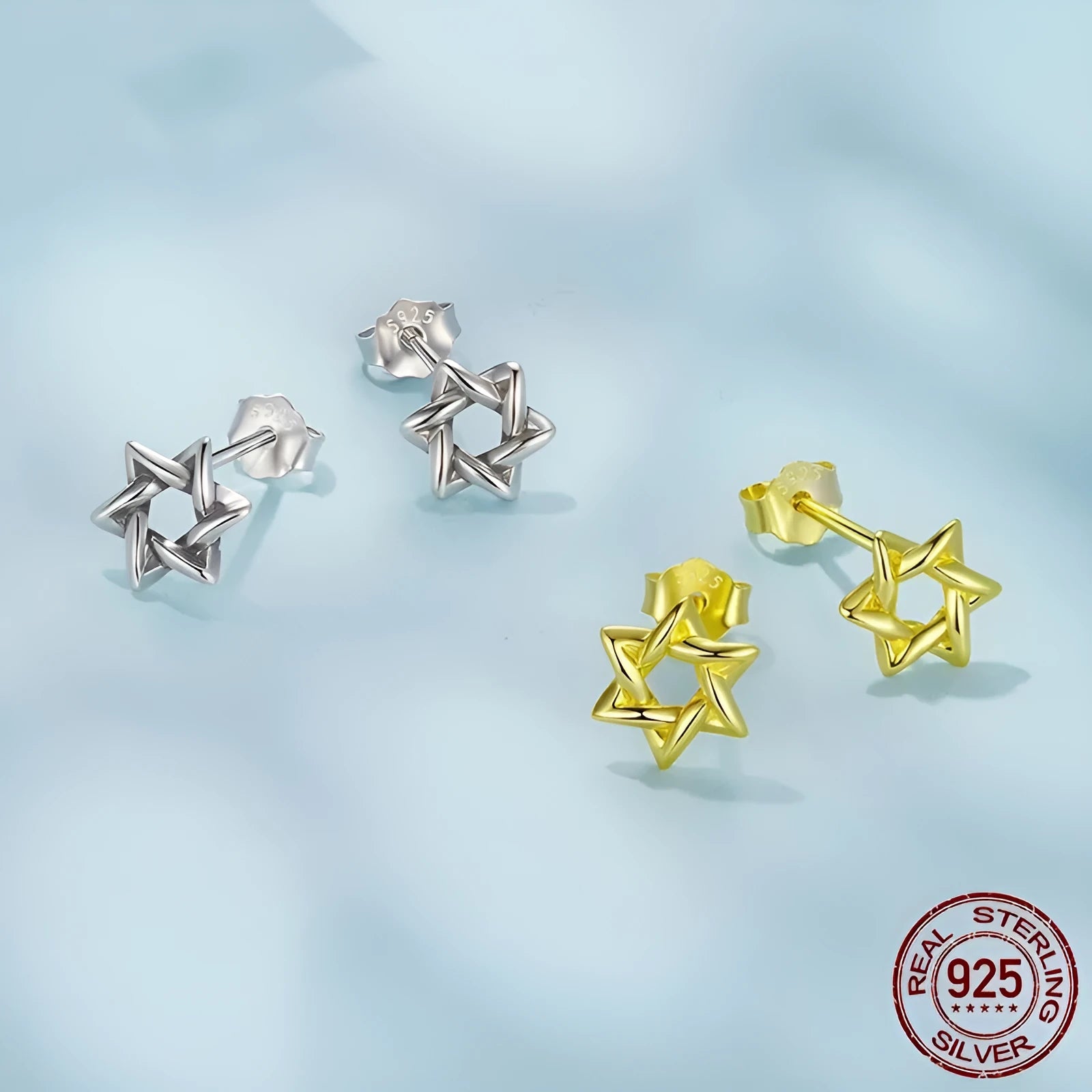 Pair of S925 sterling silver six-pointed star stud earrings on a flat surface, silver colour, 1 cm diameter