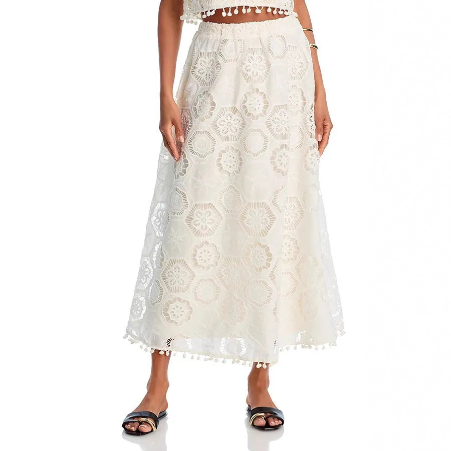 Women's white embroidered sleeveless suit with matching long skirt, retro two-piece set on a hanger