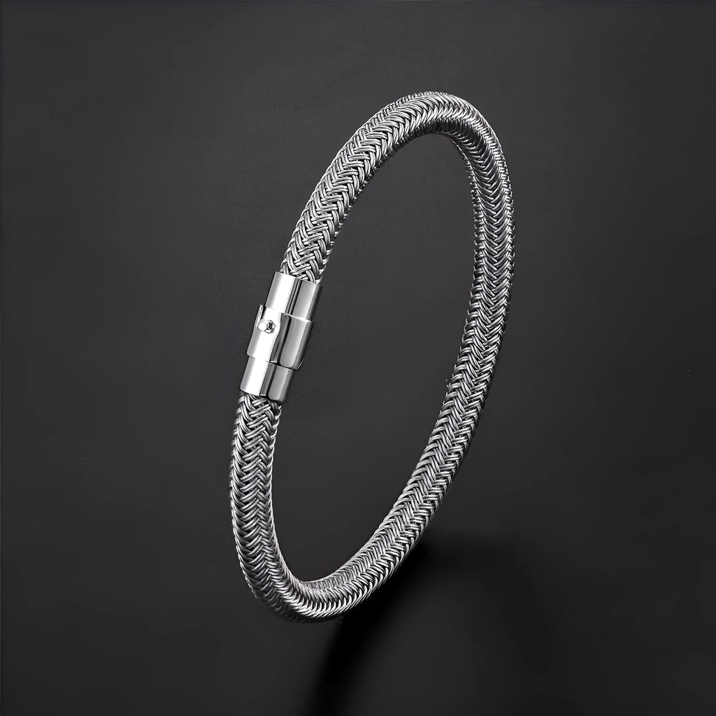 Geometric titanium steel wire bracelet with a magnetic clasp on a wrist, shown in a silver-toned finish.