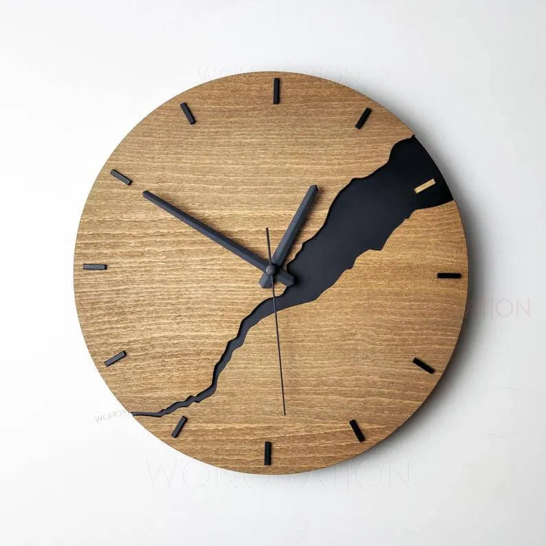 Modern wooden wall clock with a creative crack style design on its face.