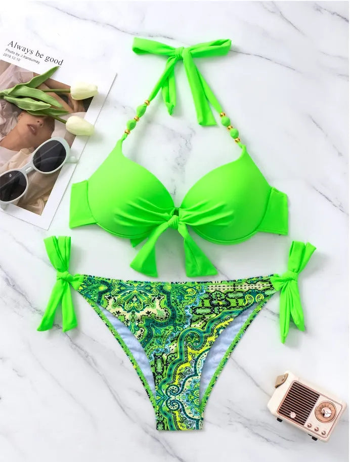 Ladies polyester bikini swimsuit set on a white background, showing top and pants in a blue colour.
