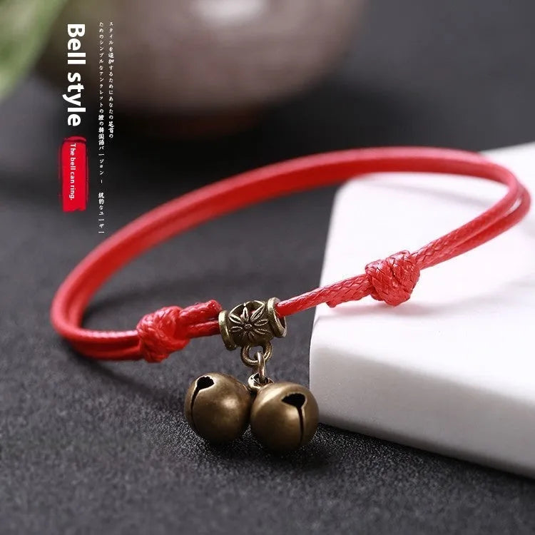 Nylon rope dog collar with brass bell shown in black, red, and coffee colours.
