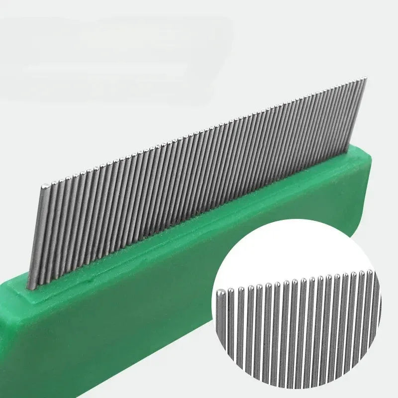 Green plastic-handled pet flea comb with stainless steel pins for dogs and cats.