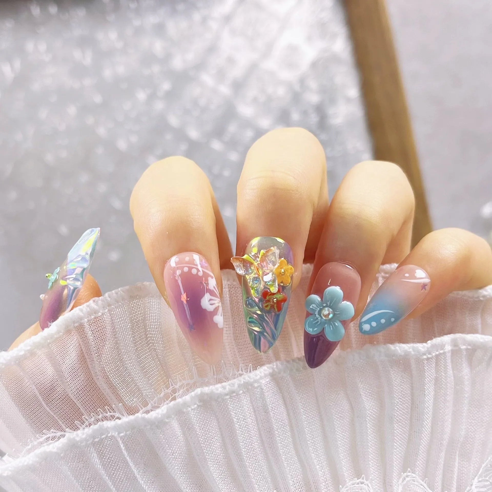 Handmade colourful flower and butterfly nail art decorations in four sizes