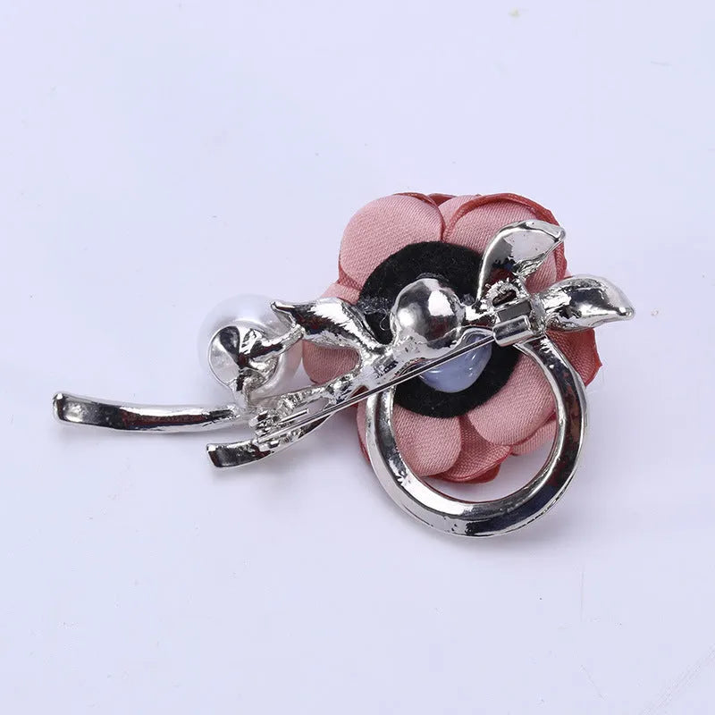 Rose brooch in Korean style, alloy construction, blue colour, 4.5cm by 3.8cm, on white background