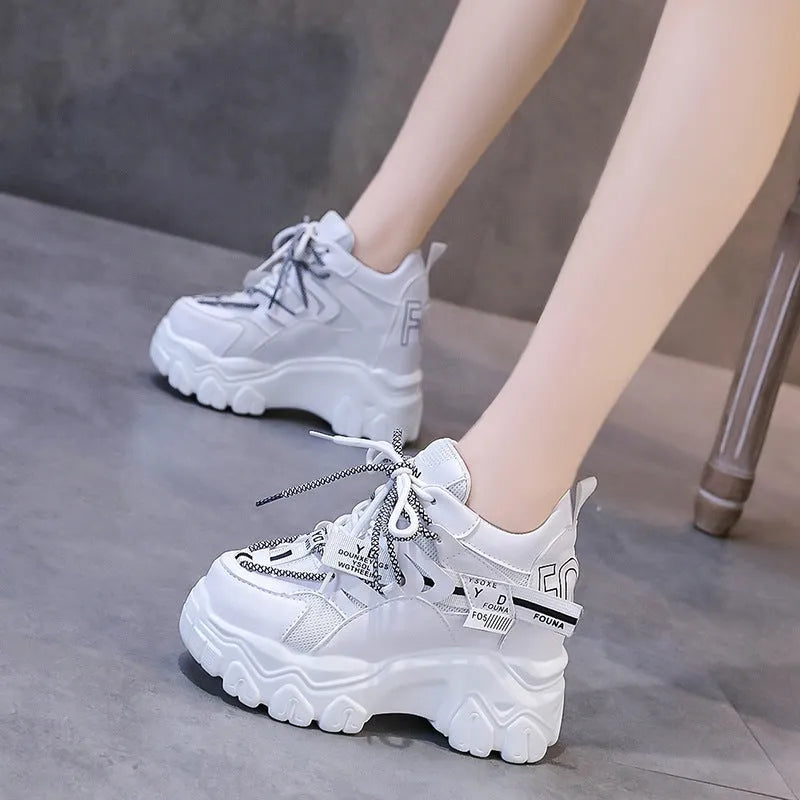 Women's white mesh platform sports shoes with a cross-strap and thick rubber sole.