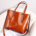 Brown genuine leather women's shoulder bag with retro styling and multiple organisational compartments
