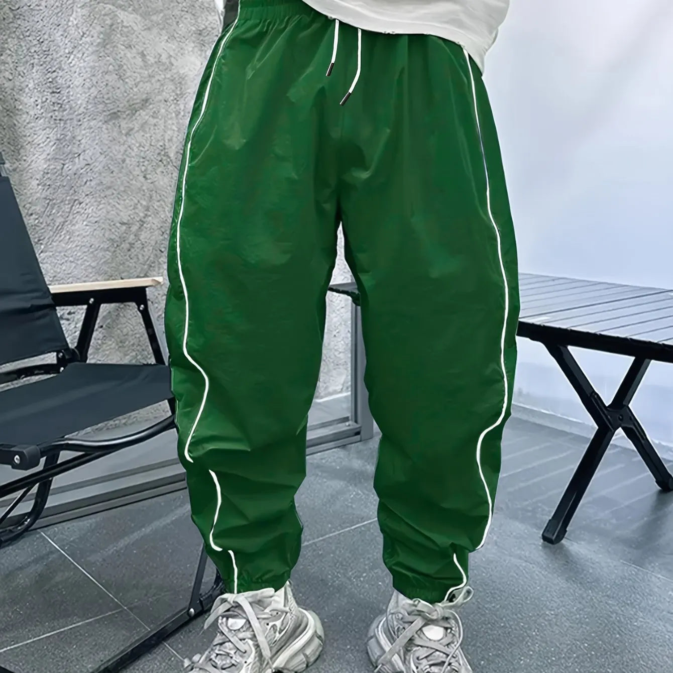 Men's loose fit bamboo fibre sports trousers in khaki with cropped length and elasticated waist.
