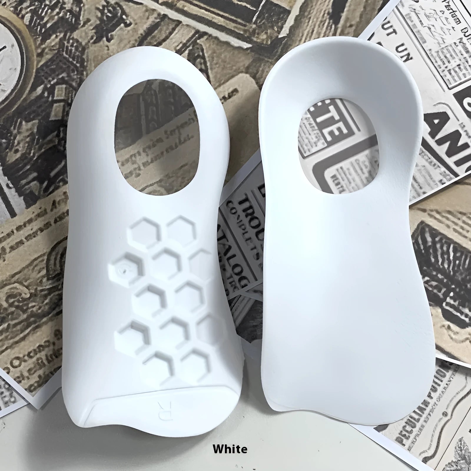White, black, and skin colour arch support insoles for varus correction, showing TPR material and S/L arch sizes.