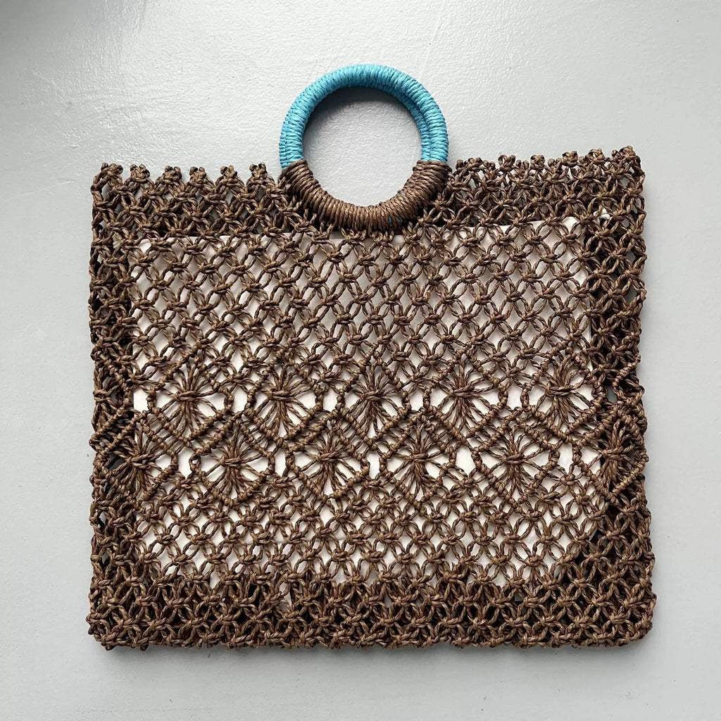 Dark brown handmade straw tote bag with square vertical shape and sandwich pocket design