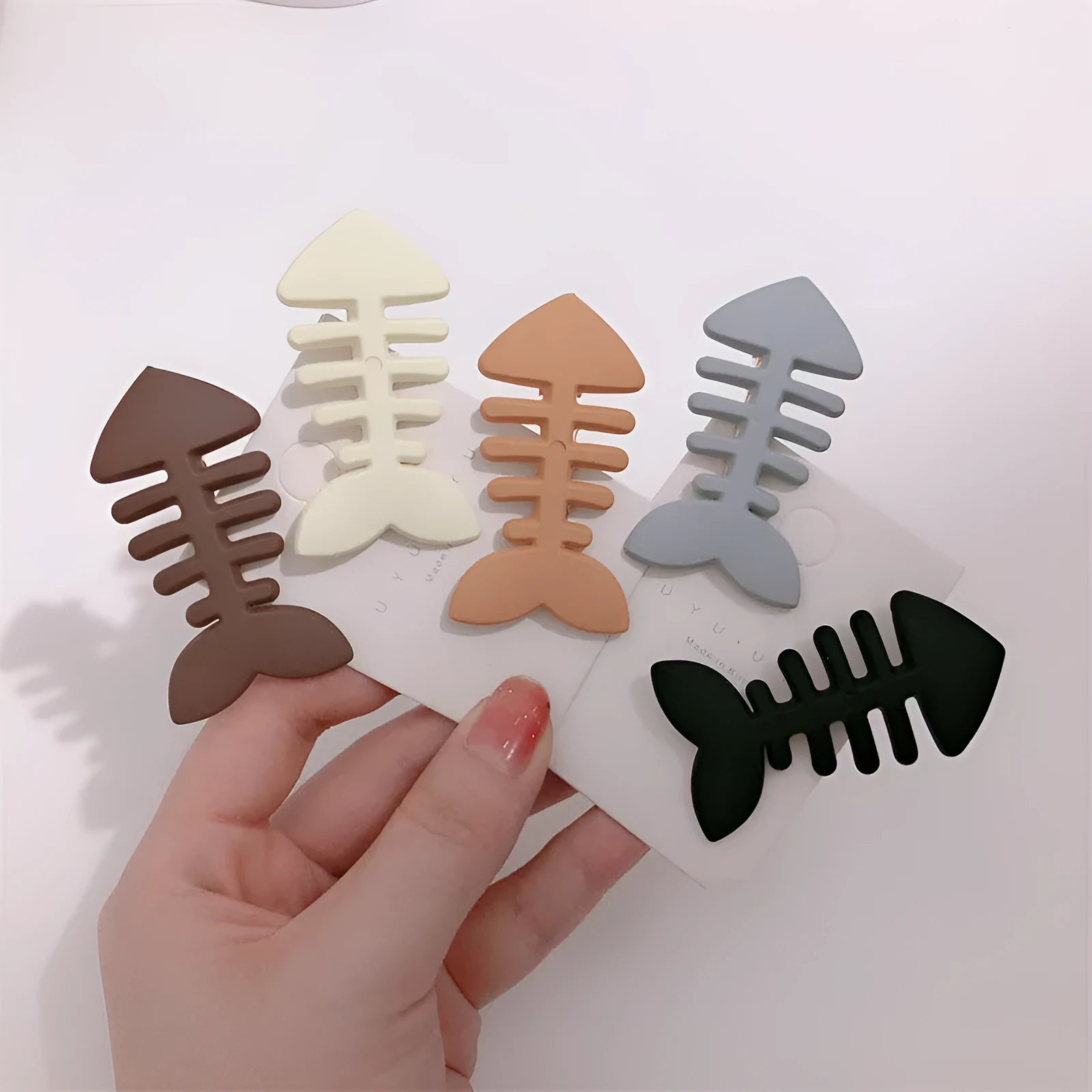 Minimalist fishbone pattern hair barrette with duckbill clip in neutral candy colour
