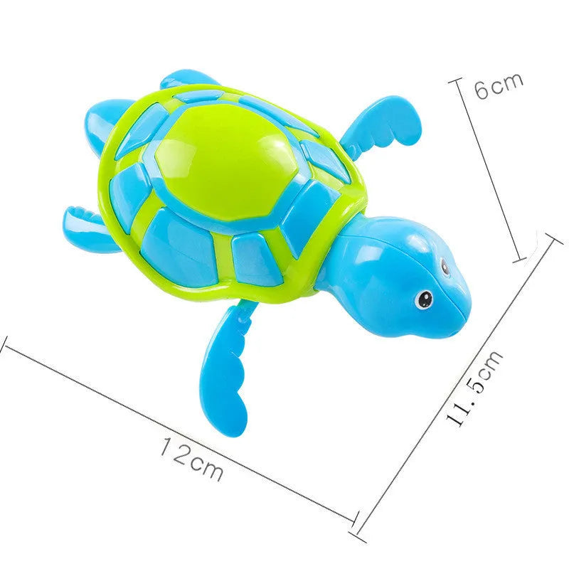 Small green plastic swimming turtle bath toy floating in water