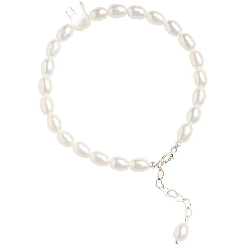 Handmade women's rabbit bracelet with 925 silver charm and white shell pearl beads on elastic string