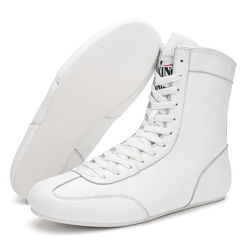 Professional boxing shoes with leather and mesh construction in black gold colour with non-slip soles