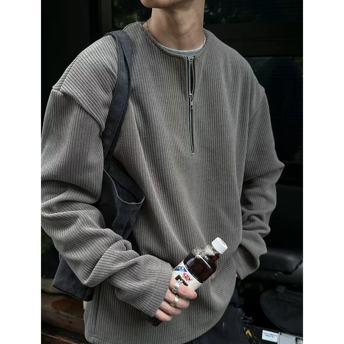 Solid colour loose fit long sleeve pullover top in grey, black, or apricot.