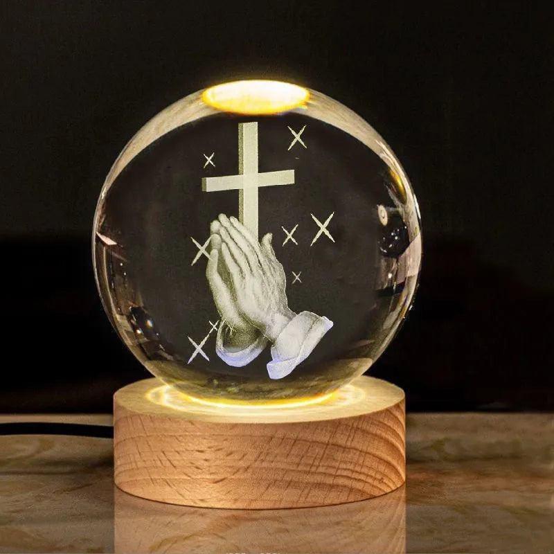 White crystal ball desk ornament on a wooden warm light base, showing purity-themed designs.