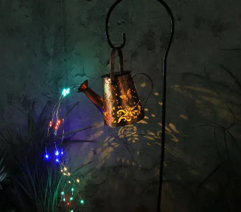 Solar garden lamp with iron butterfly pattern and warm white LED light for outdoor use.