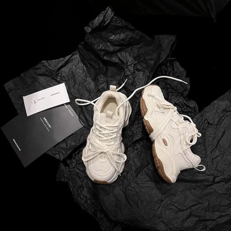 Beige women's platform heel dad sneakers with round toe and front lace-up fastening.