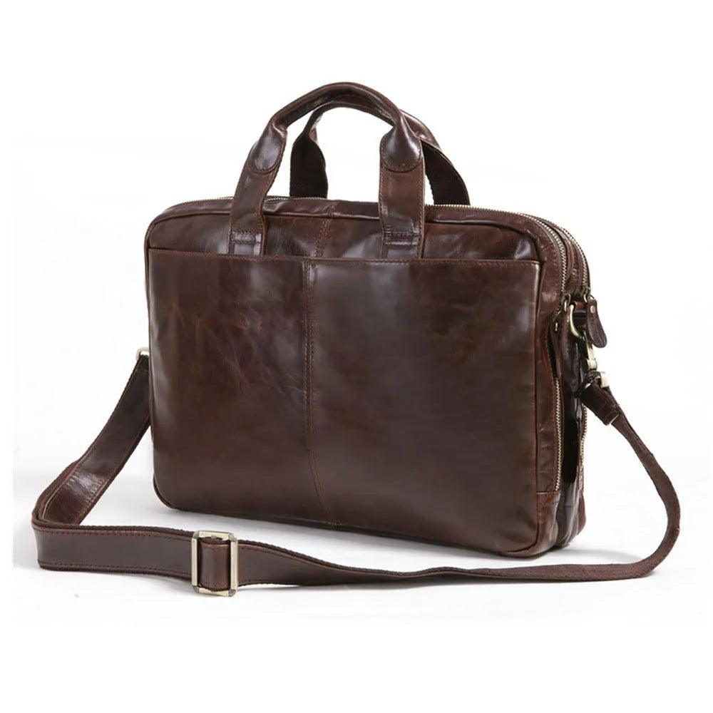 Brown leather men's business briefcase with laptop compartment showing cowhide texture