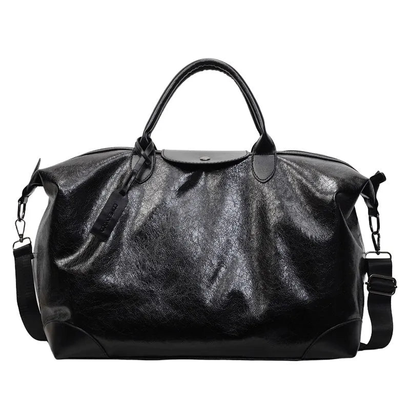 Large hand-carry travel bag for women in black colour showing storage capacity
