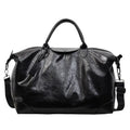 Large hand-carry travel bag for women in black colour showing storage capacity
