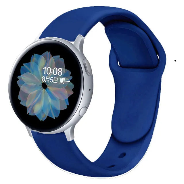 Samsung Galaxy Active 2 watch with a purple reverse buckle silicone strap on a wrist.