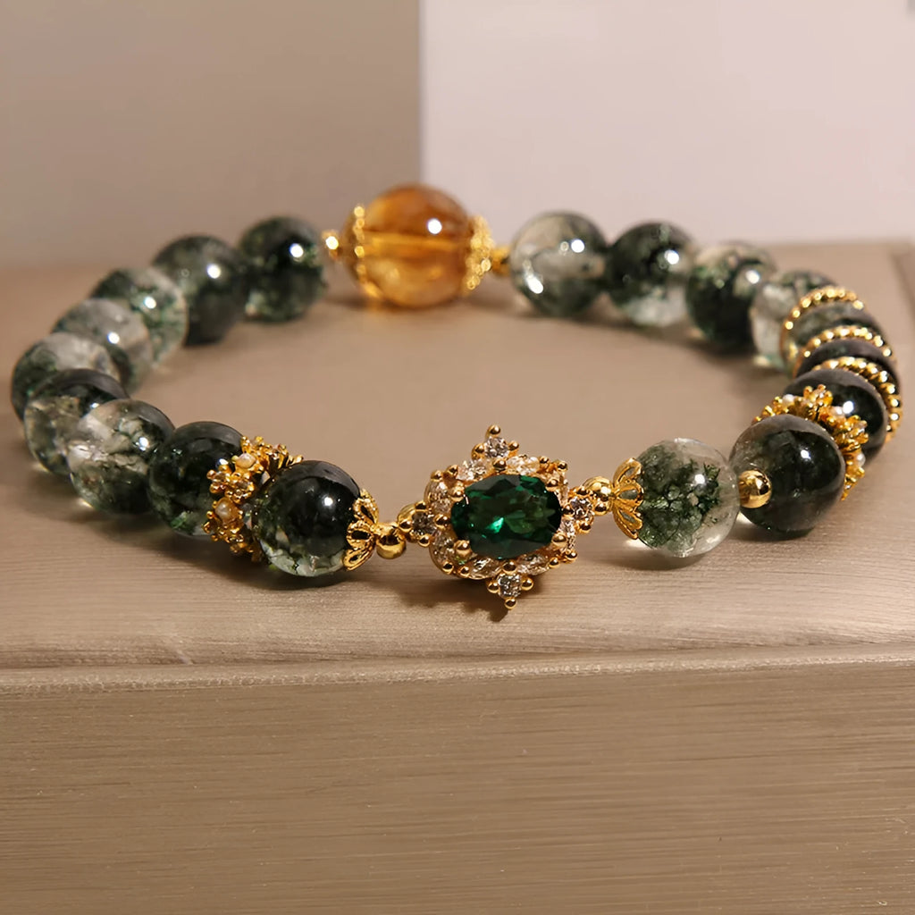 Women's green phantom quartz crystal bracelet with gold rutile needle inclusions and rhinestone accents