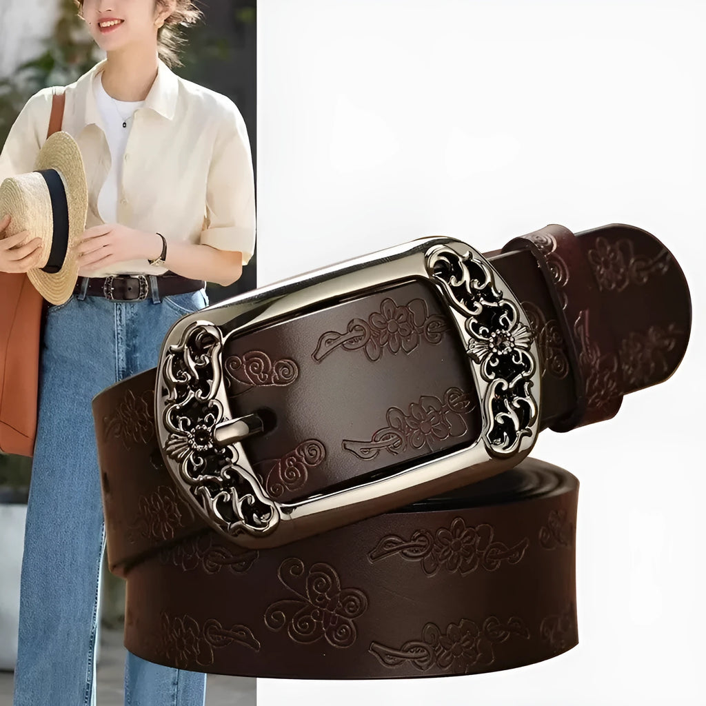 Thin black PU leather women's decorative belt with an alloy buckle on a pair of jeans.