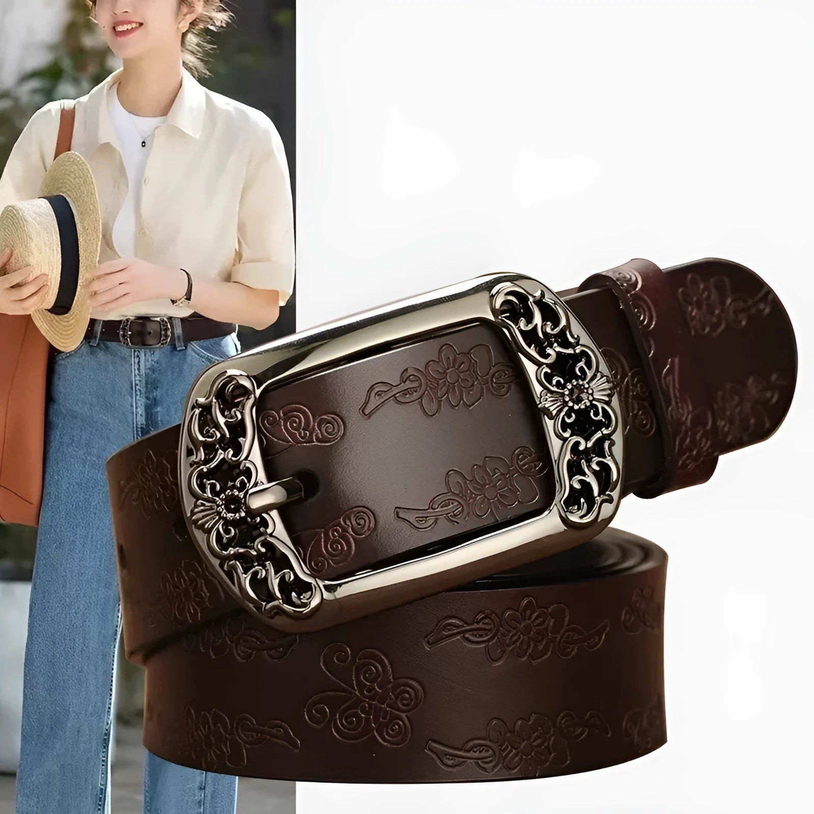 Thin black PU leather women's decorative belt with an alloy buckle on a pair of jeans.