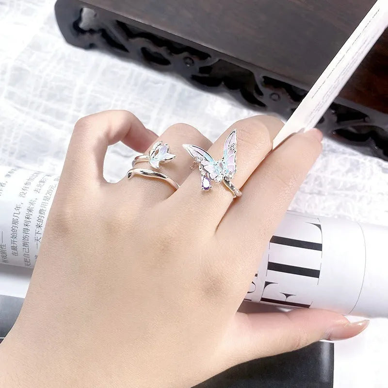 Adjustable copper insect ring on a finger, showing drip-oil finish in colour JZ2868A.