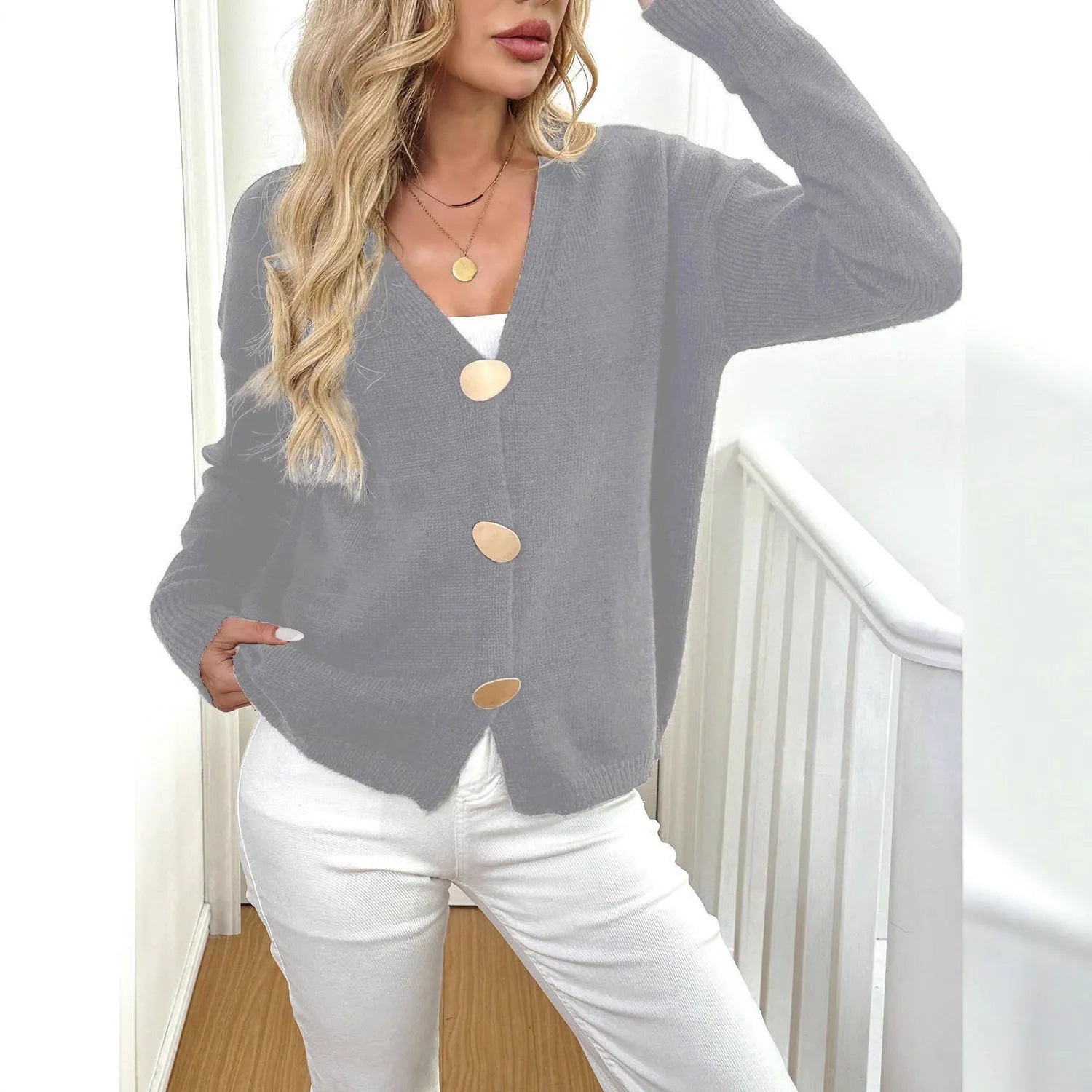 A grey women's deer plush sweater coat with long princess sleeves and an irregular hem.