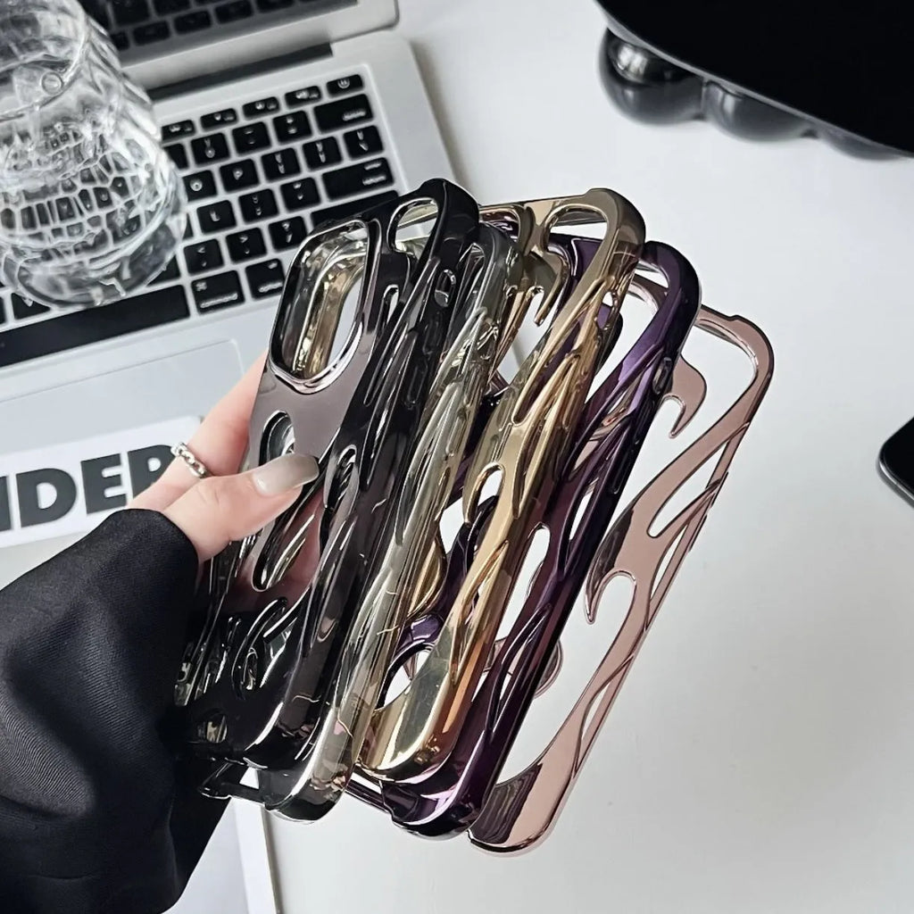 Electroplated hollow flame pattern iPhone case in silver, showing detailed cut-outs and metallic finish on a phone.