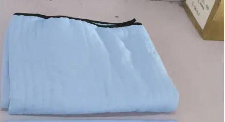 Lightweight seersucker summer quilt in various colours on a bed