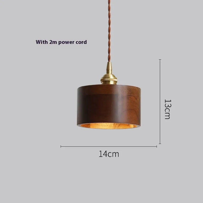 Black walnut and copper single-head droplight chandelier suspended from a ceiling.