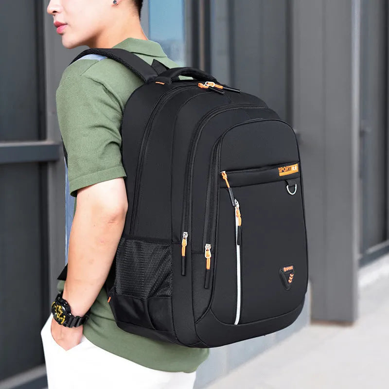 Men's Oxford cloth schoolbag in red with letter pattern, showing air pillow belt burden reduction system