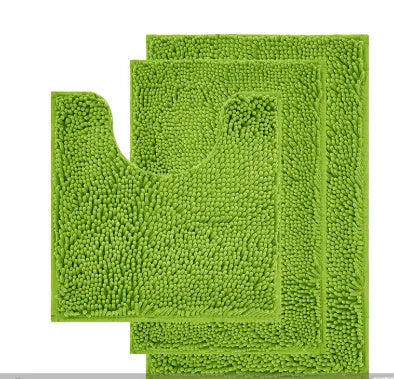 Chenille U-shaped three-piece bathroom carpet set in green beside a toilet.
