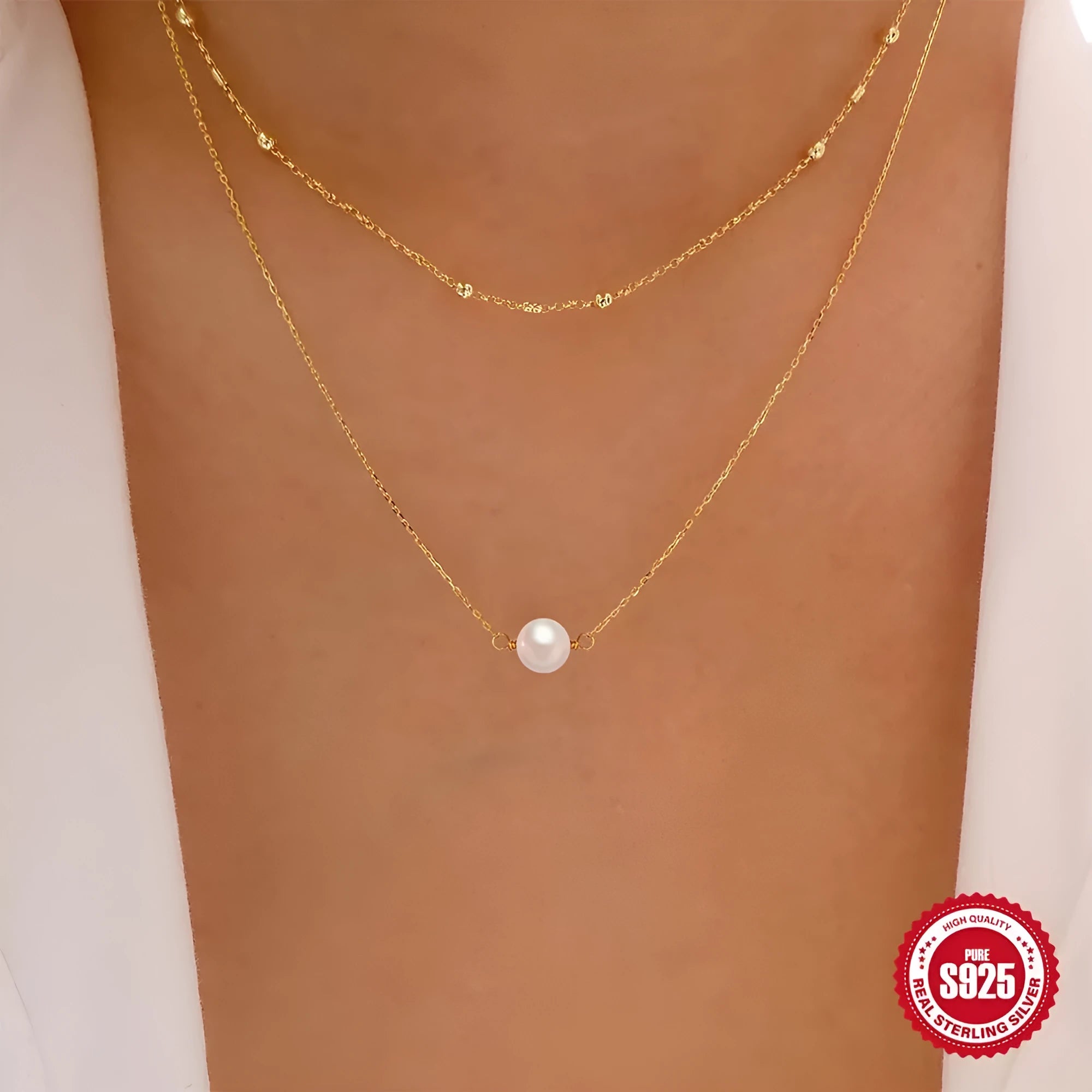 Sterling silver geometric pendant necklace with two pearls, on a ball bead chain, shown in gold and white gold plating.