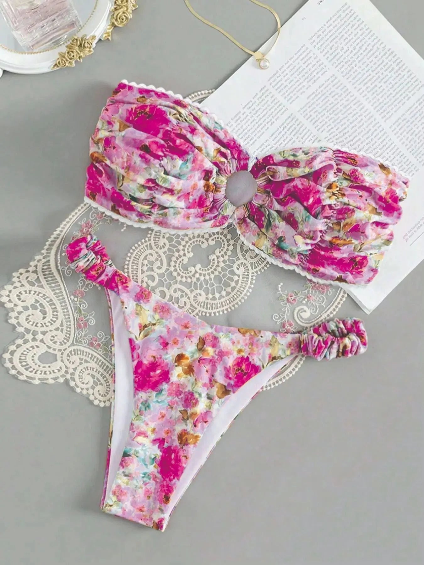 Women's polyester bikini set with floral print tube top and matching briefs for swimming.