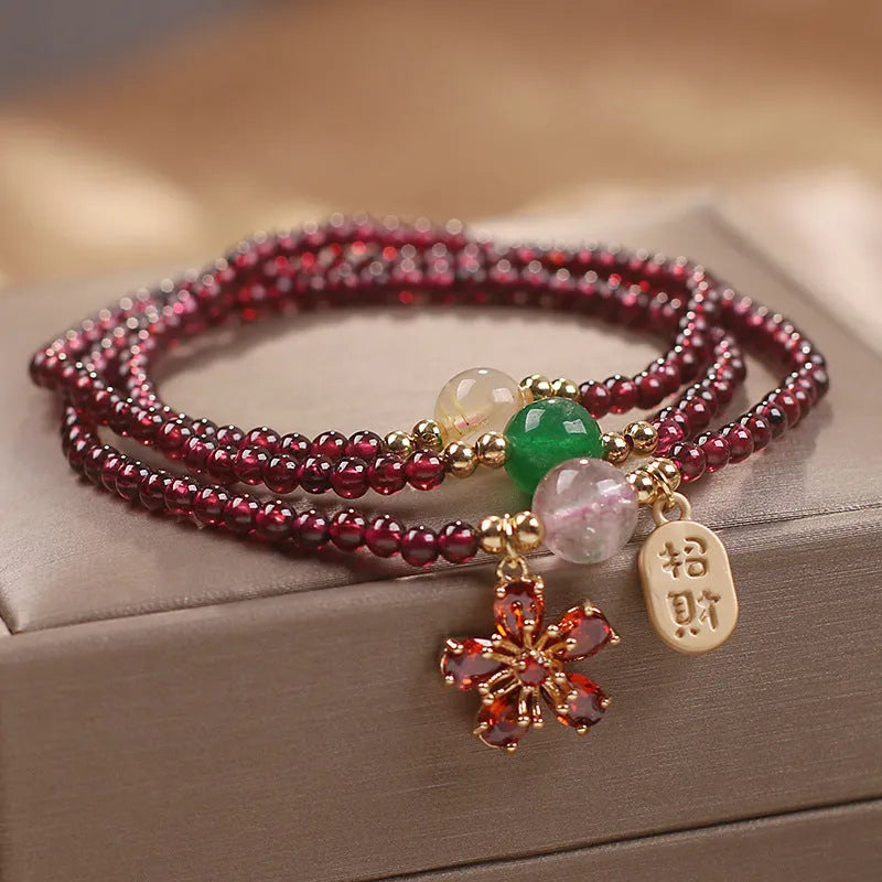 Women's natural crystal bracelet in pomegranate red cherry blossom colour with sequins detailing
