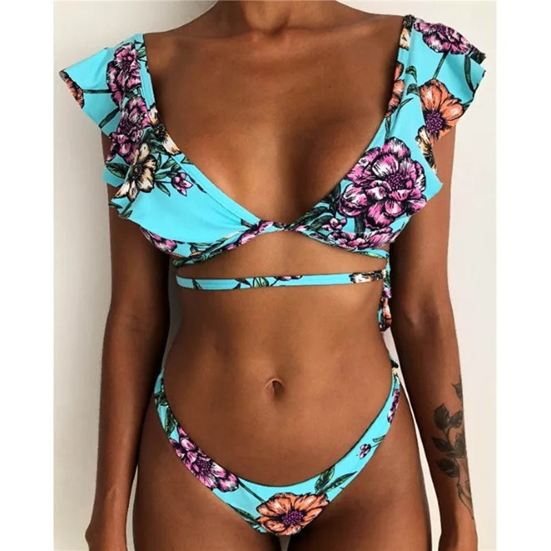 Yellow floral print split style bikini swimsuit on a mannequin.