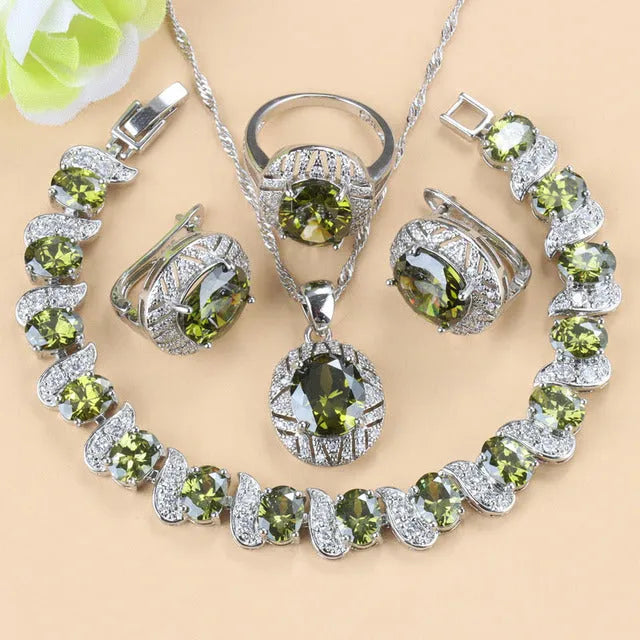Mixed gem-inlaid copper jewellery set including pendant necklace, earrings, ring, and bracelet in green colour