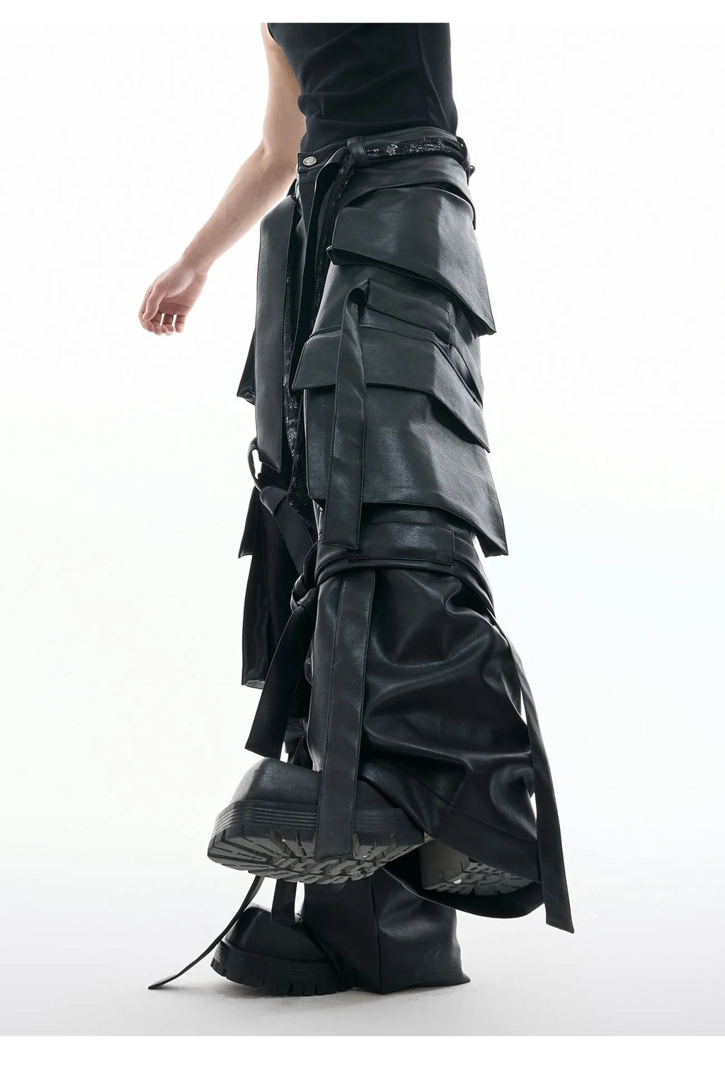 Black loose-fit trousers with a quilted pattern and multiple pockets on a mannequin.