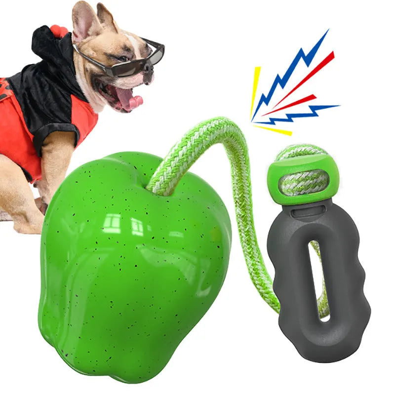 Green and red plastic dog dental ball toys with textured surfaces and hollow interactive feeder design