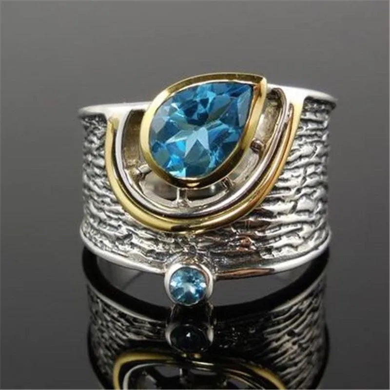 Chinese-style women's ring with blue rhinestones in drop shape design on alloy band