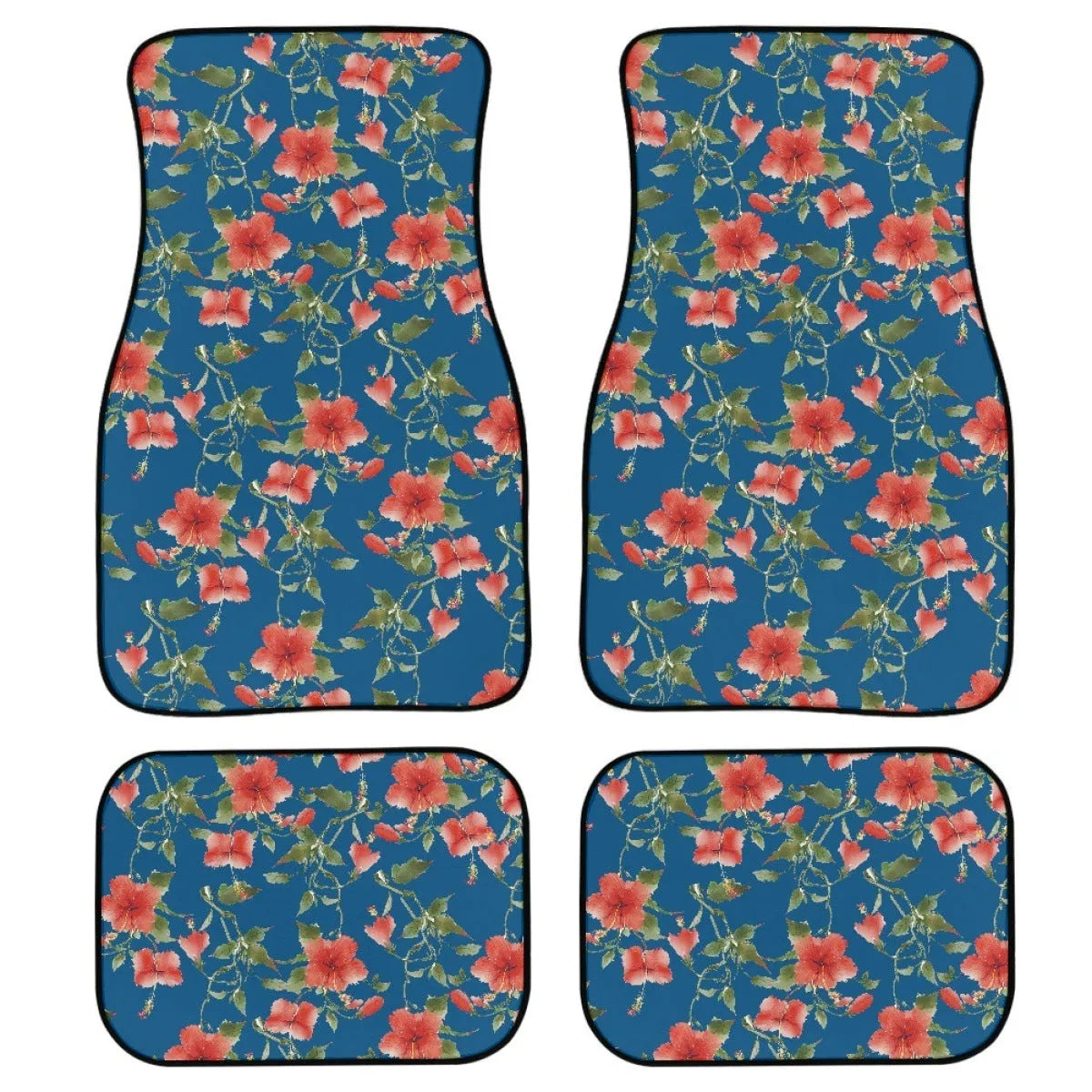Set of four black rubber car floor mats with a textured surface, shown in a vehicle footwell.