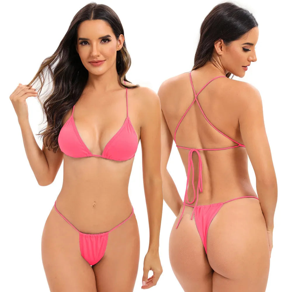 Women's candy coloured cross strap split swimsuit with multiple adjustable straps on a mannequin.
