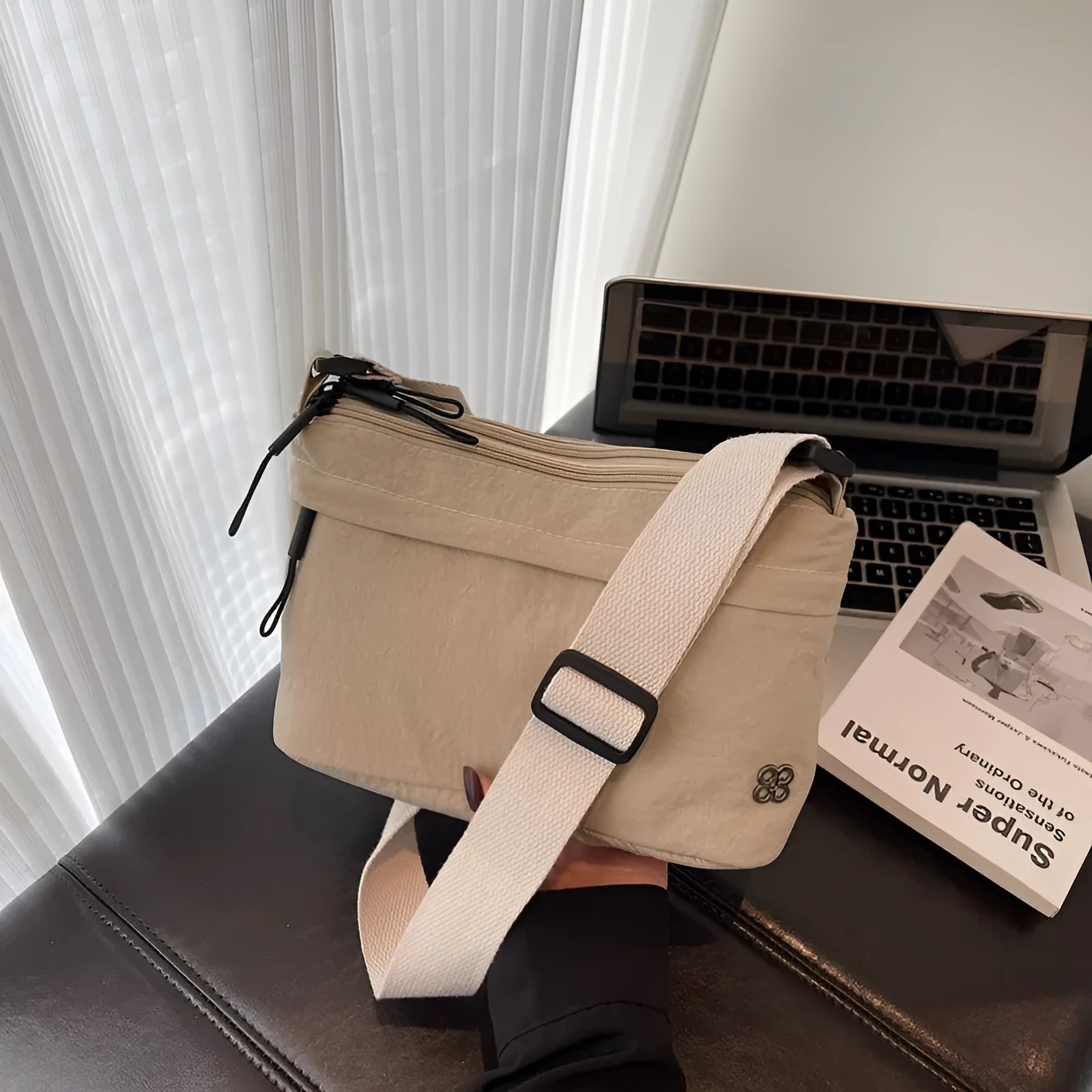 Soft cloth daily lightweight commuter crossbody bag in beige with sandwich pocket and sewn-thread detailing