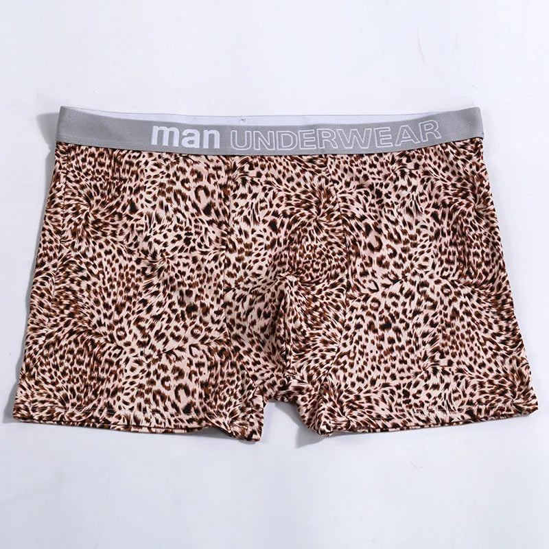 Men's loose fit leopard print underwear in milk silk polyester fabric showing mid-waist design